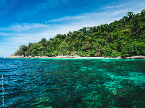 Scenic view of Koh Mai Phai Island crystal clear emerald sea water with coral reef transparent. Snorkeling spot. Near Koh Lipe Island, Tarutao National Marine Park, Satun, Thailand. © Chavakorn
