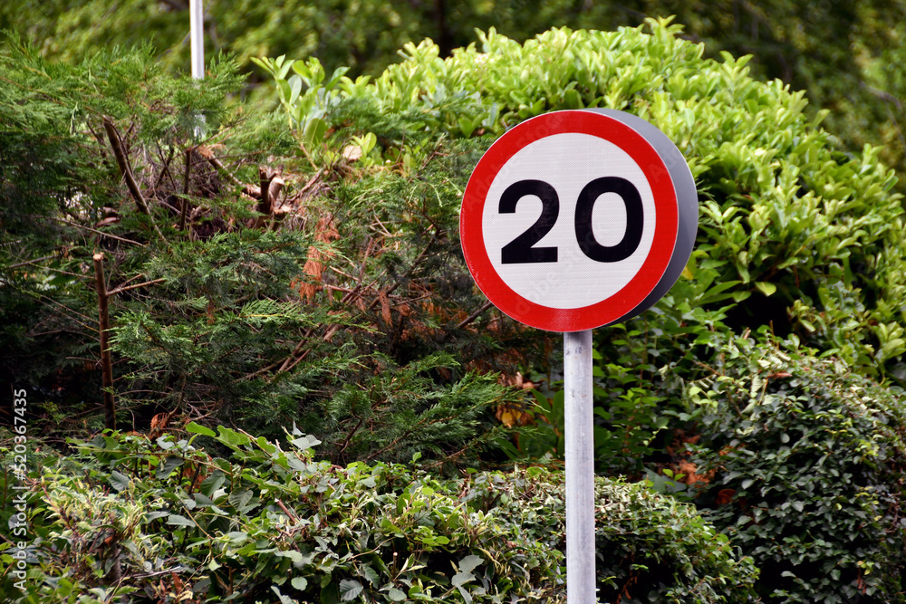 Road sign showing a 20 mph speed limit at the approach to a residential area - obrazy, fototapety, plakaty 