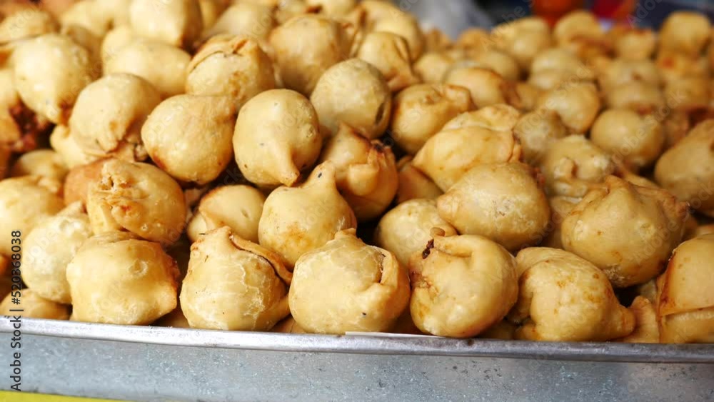 detail shot of a indian food singara display for sale at street detail shot of a indian food singara display for sale at street