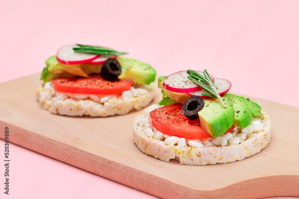 Rice Cake Sandwiches with Avocado, Tomato, Cottage Cheese, Olives and Radish on Wooden Cutting Board. Easy Breakfast. Diet Food. Quick and Healthy Sandwiches. Crispbread with Tasty Filling
