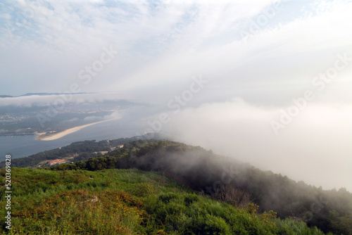 Mouth of the Miño river with fog. View from Mount Tegra, on the other side of Portugal. A Guarda, Galicia, Spain.