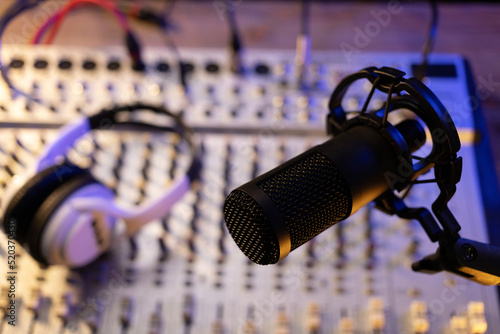 Microphone and sound mixer at audio mixing console. Music concept in record studio © Svitlana
