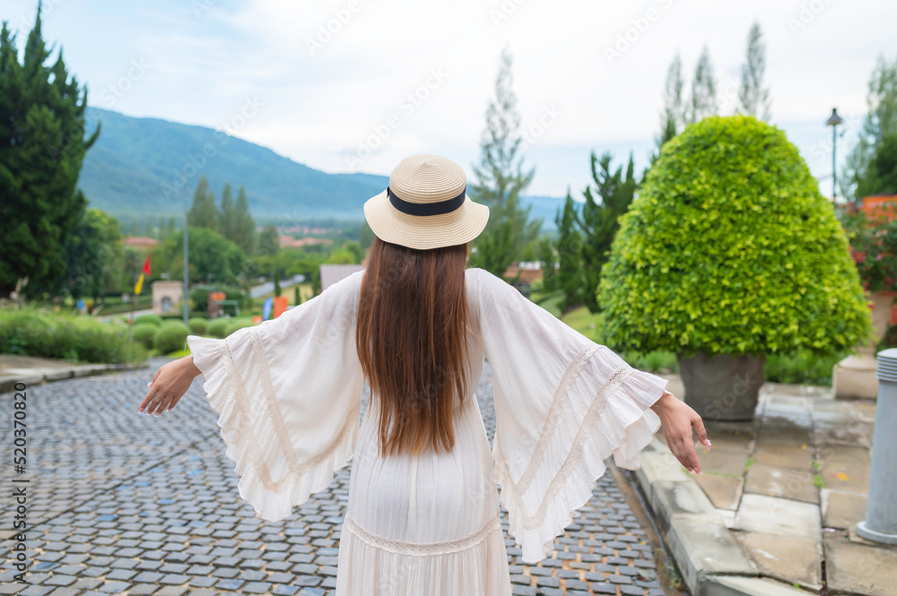 Asian woman traveling at the old town italy style,Alone travel,Lifestyle of single girl,View mountain with fog