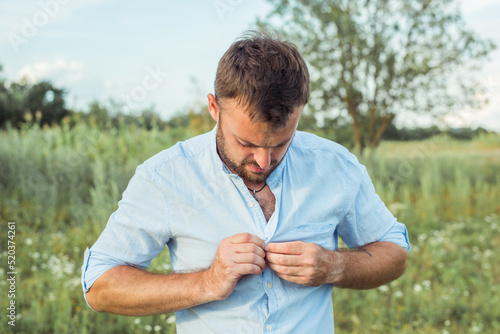 bearded man on nature rest in a shirt on vacation