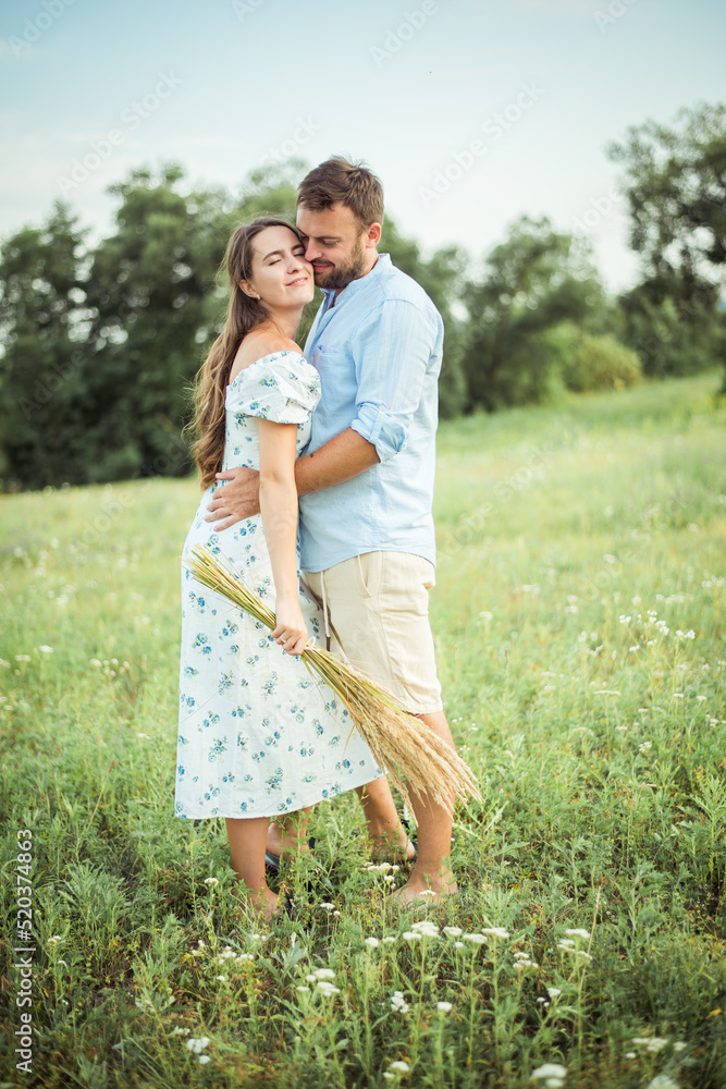 Fototapeta premium woman and bearded man on field nature picnic