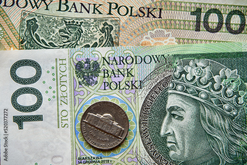banknot 100 złotowy i moneta USA,100 zloty banknote and a US coin