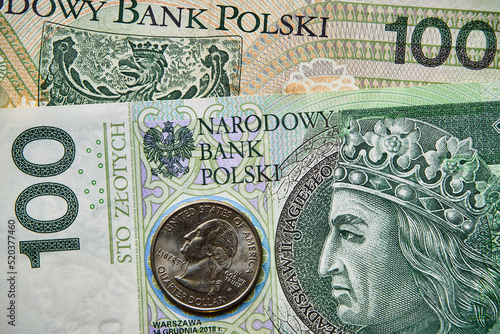 banknot 100 złotowy i moneta USA,100 zloty banknote and a US coin