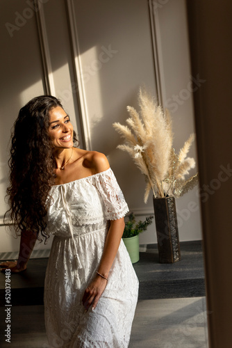Young curly hair woman stan...