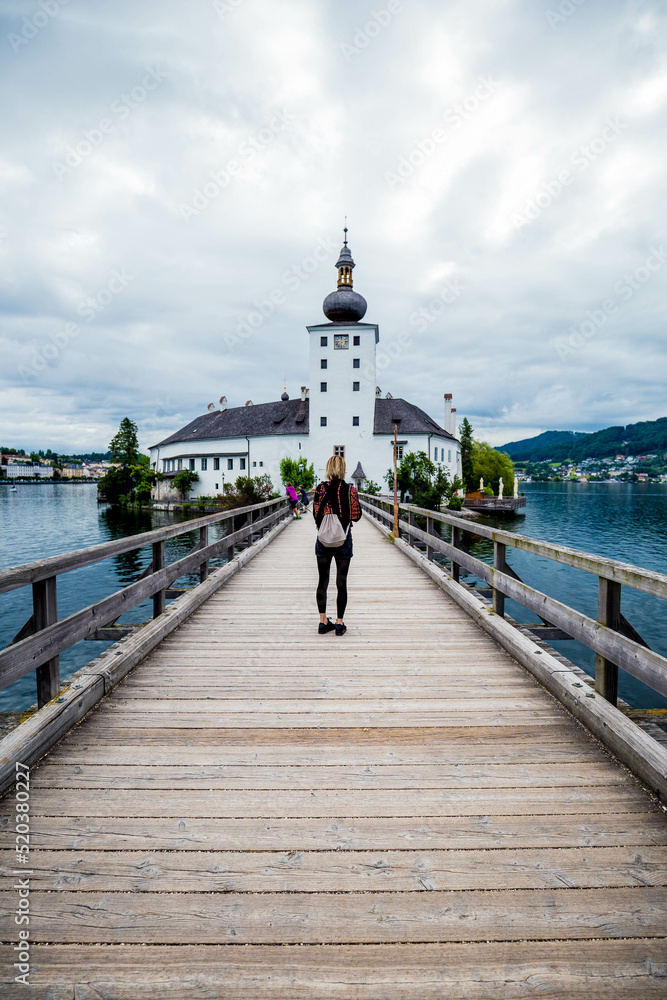 Traveler photographer walking in Schloss Ort in Gmunden am Traunsee, beautiful lake