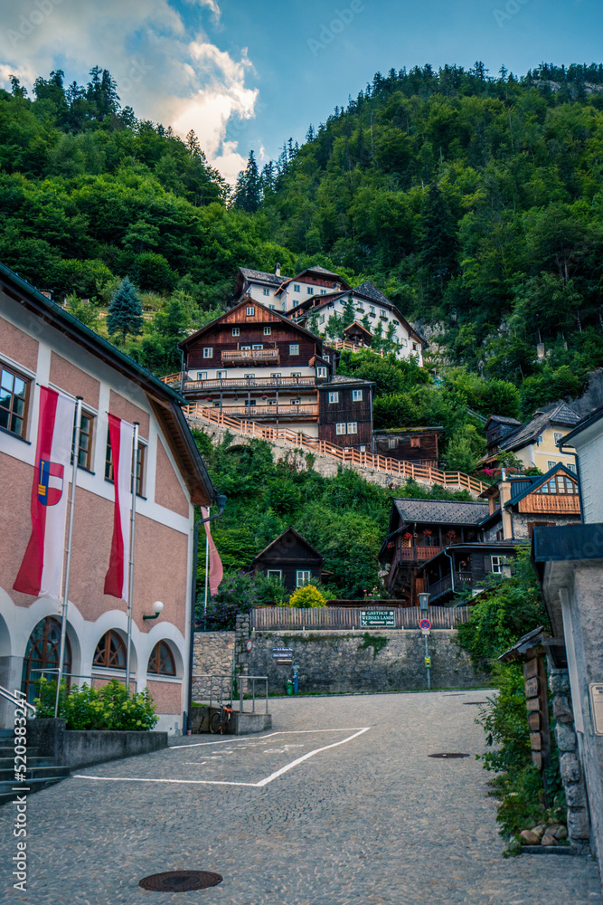 Hallstatt houses, Hallstat village in the Austria. Beautiful village in the mountain valley near lake. Mountains landscape and old town. Travel - Austria Hallstatt houses, Hallstat village in the Austria. Beautiful village in the mountain valley near lake. Mountains landscape and old town. Travel - Austria