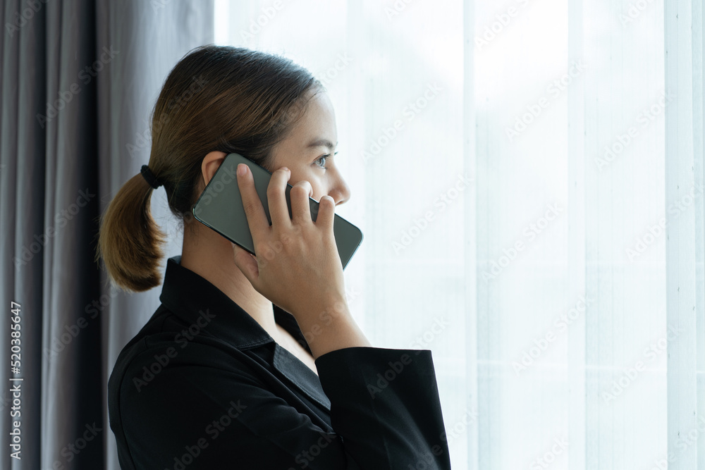 Asian businesswoman talking on mobile phone Asian businesswoman talking on mobile phone