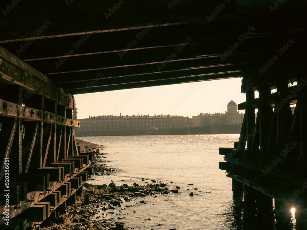 Under the wooden bridge at sunset time, historical places and architecture in Saint Petersburg. Under the wooden bridge at sunset time, historical places and architecture in Saint Petersburg.