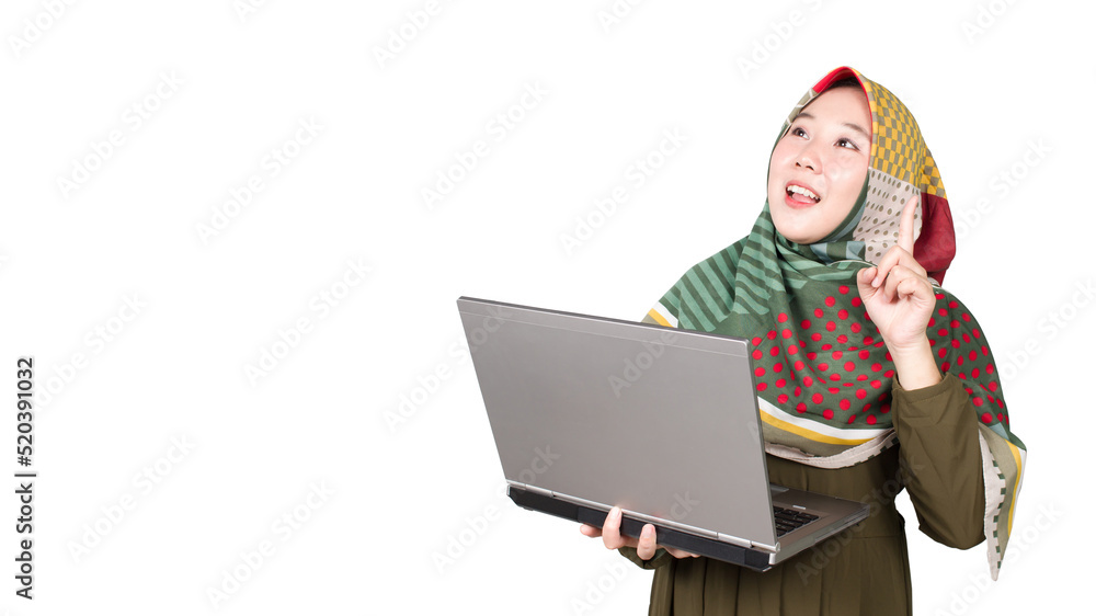 Asian Muslim woman getting an idea while working in front of her laptop Asian Muslim woman getting an idea while working in front of her laptop