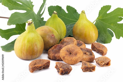 Fresh and dry figs with leaves isolated on bright background. Close up view.