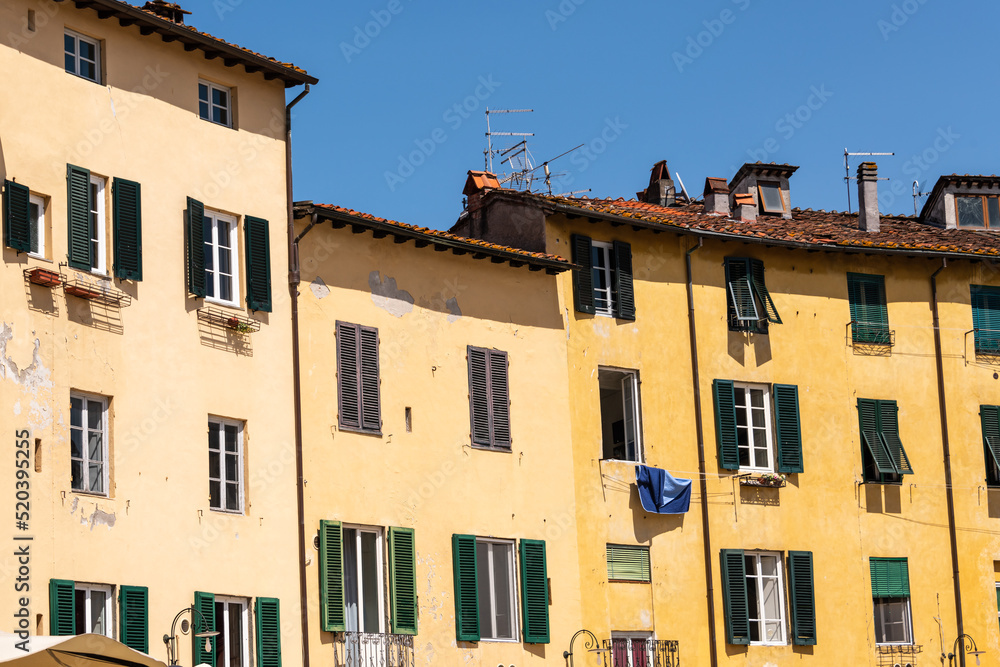 Weathered House Facade At The Famous Piazza dell'Anfiteatro In Lucca Weathered House Facade At The Famous Piazza dell'Anfiteatro In Lucca