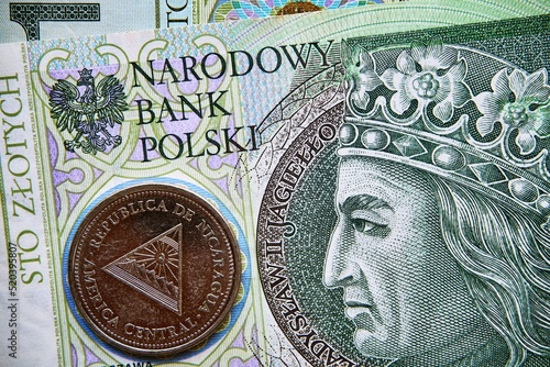 polski banknot,100 PLN, nikaraguańska moneta , Polish banknote, 100 PLN, Nicaraguan coin photo