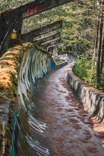 Sarajevo, Bosnia and Herzegovina - September 23, 2021. Abandoned Olympic Bobsleigh and Luge Track, built for the XIV Olympic Winter Games in 1984 and destroyed during Siege of Sarajevo