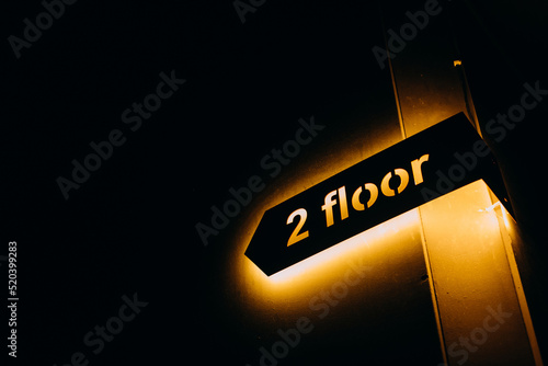фотографія pointer arrow second floor yellow backlight dark