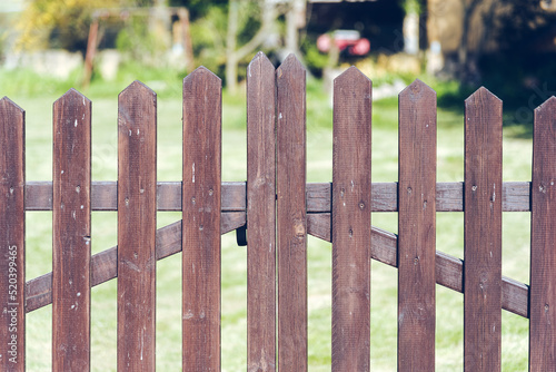 Brown wooden backyard gate.