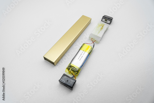 Disassembled into individual parts electronic cigarette. The internal device of the electronic cigarette. Vape device. Selective focus