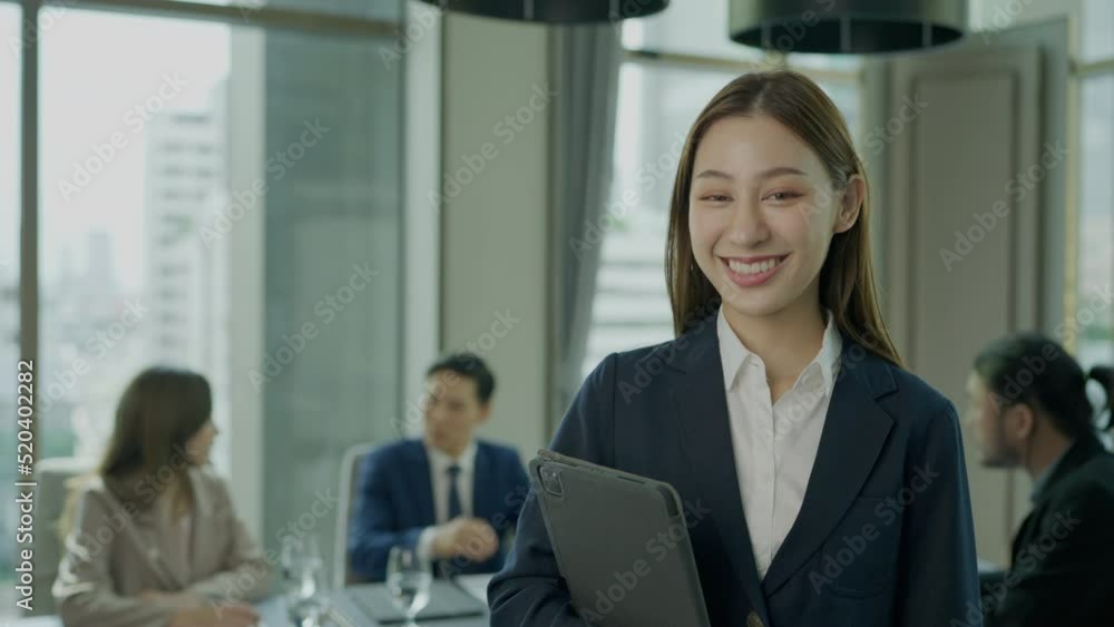 Portrait of beautiful business woman looking to camera and smiling. They success to planning business project together. Portrait of beautiful business woman looking to camera and smiling. They success to planning business project together.