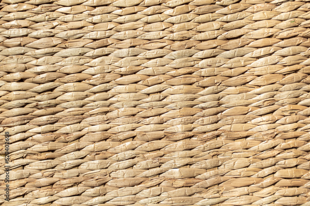 background of light yellow mat woven from reeds background of light yellow mat woven from reeds