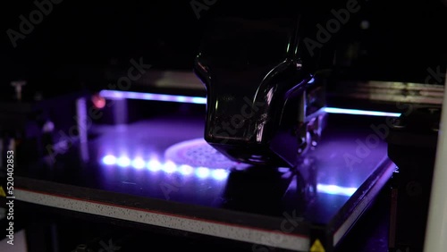 3d printer prints object close-up. Automatic three dimensional 3D printer.