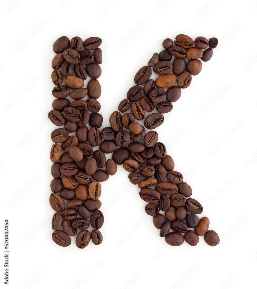 Capital letter K made from coffee beans. Coffee font. Alphabet made from coffee beans. White background. Roasted coffee beans. Capital letter K made from coffee beans. Coffee font. Alphabet made from coffee beans. White background. Roasted coffee beans.
