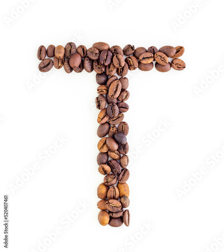 Capital letter T made from coffee beans. Coffee font. Alphabet made from coffee beans. White background. Roasted coffee beans.