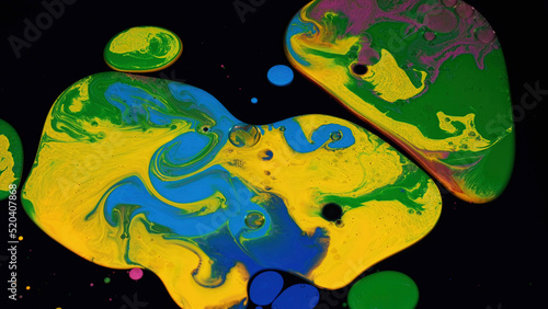 Fluid art background with colorful tints  liquid surface. Stock footage. Amazing effect of acrylic paints on black canvas  mixing different bright colors.