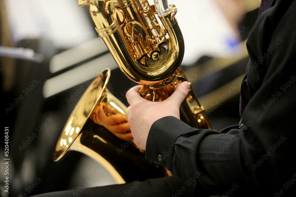 Obraz premium Closeup of Musician Playing Baritone Saxophone
