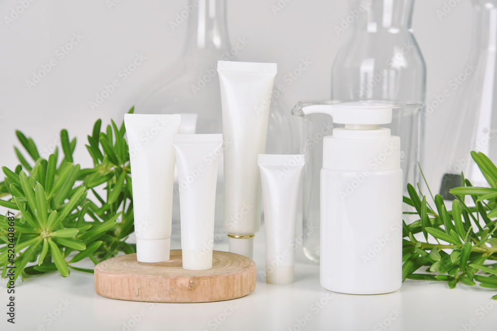 Natural skincare beauty product, Cosmetic white bottle containers packaging with green nature leaves, Blank label for organic spa branding mock-up,Herbal healthy skin care. Natural skincare beauty product, Cosmetic white bottle containers packaging with green nature leaves, Blank label for organic spa branding mock-up,Herbal healthy skin care.