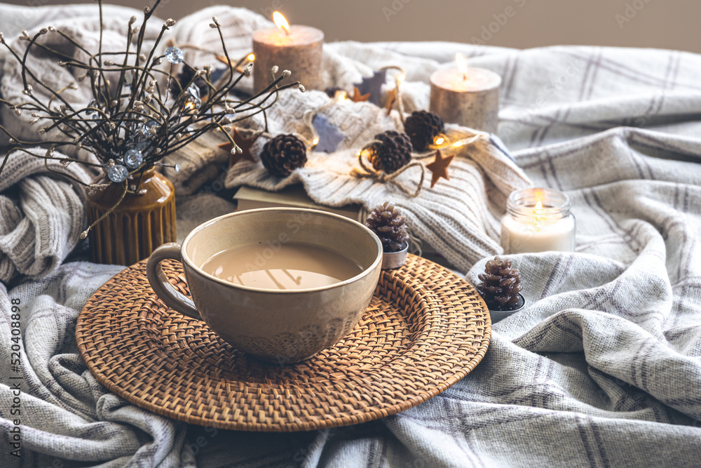 Cozy autumn composition with a big cup of coffee in bed. Cozy autumn composition with a big cup of coffee in bed.