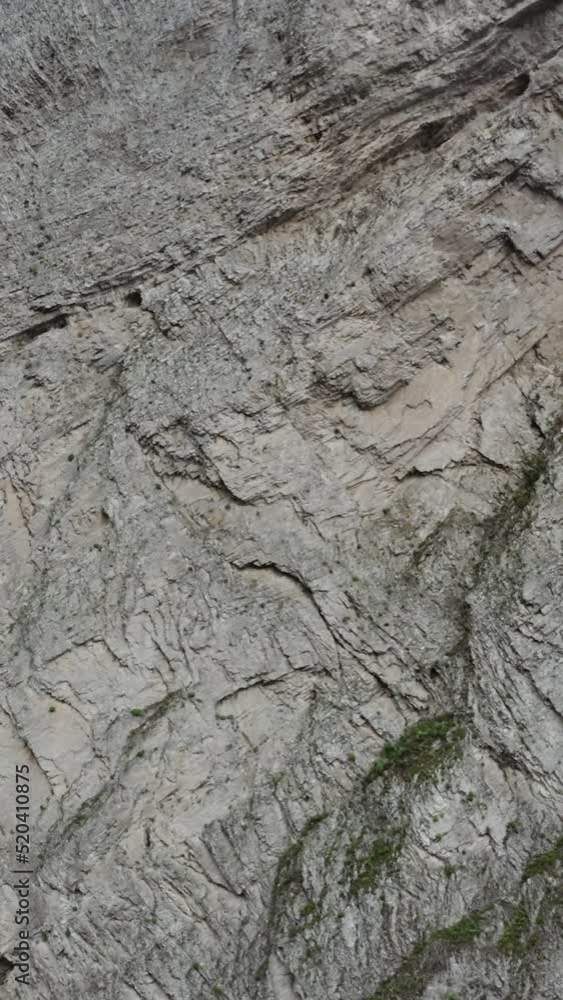 Russia, Caucasus. A slope of rocky mountains with many cracks and chips Russia, Caucasus. A slope of rocky mountains with many cracks and chips