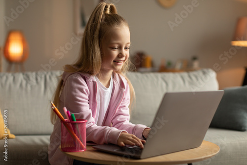 School Kid Girl Typing Using Laptop Learning Online At Home