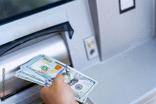 Atm money cash machine. Woman withdraw money bill. Holding american hundred dollar cash. Bank credit card, us dollar.