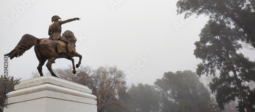 Bahia Blanca-Buenos Aires-Argentina-July, 31, 2022. Monument to the liberator Jose de San Martin riding his horse pointing to the horizon with his finger to the horizon in the mist. ample  (Editorial) photo