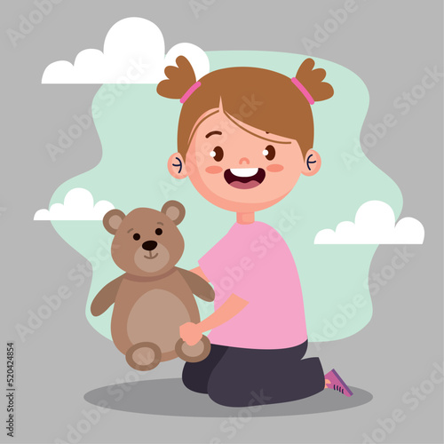 little girl playing with teddy