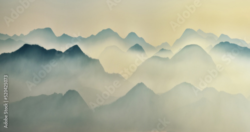 Predawn time in the highlands. mountain silhouettes in the fog
