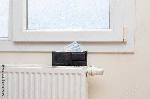 Wallpaper Mural Turkish lira banknotes on heating radiator, the concept of expensive heating costs, close-up Torontodigital.ca