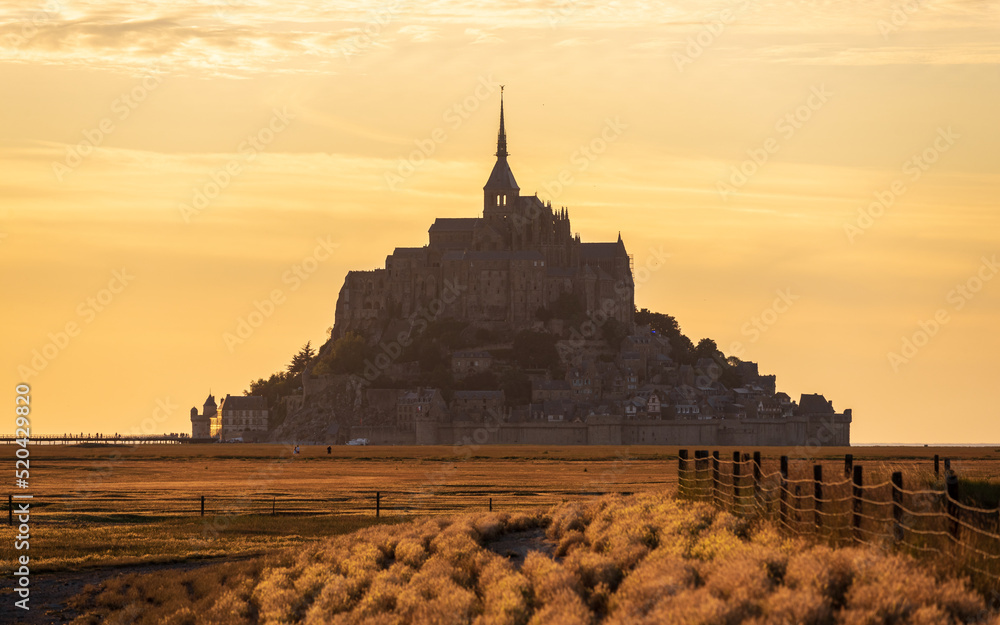 View of Mont-Saint-Michel at sunset (golden hour).