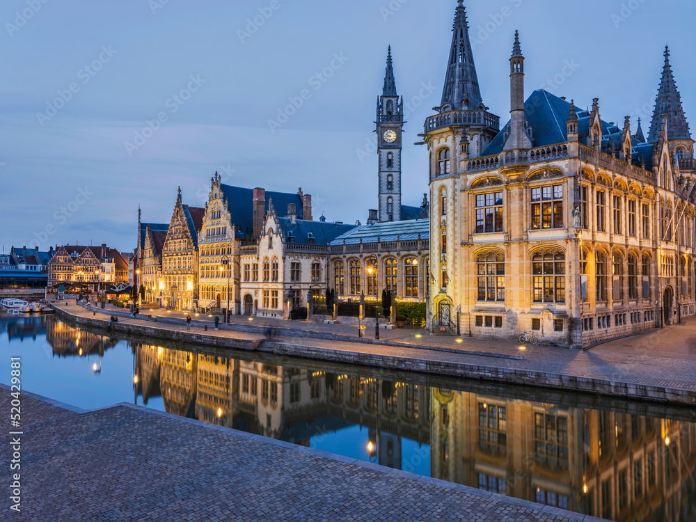 Historic medieval building at dusk on Leie river in Ghent, Belgium Historic medieval building at dusk on Leie river in Ghent, Belgium