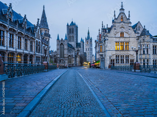 Cobble Stones road on top of Sint-Michielsbrug Arched stone bridge at dust in Ghent, Belgium