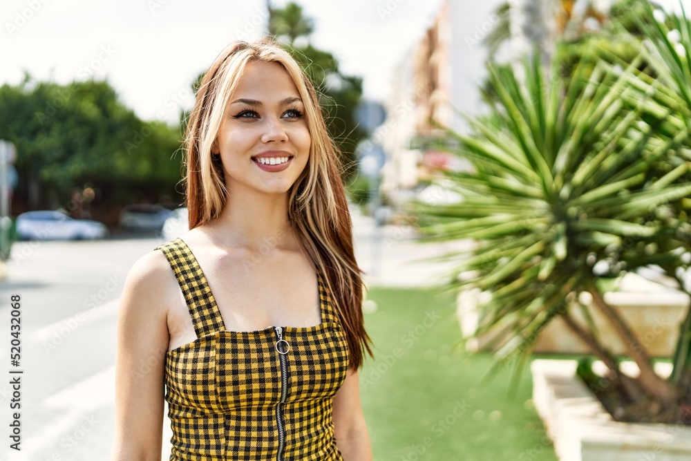 Young caucasian girl smiling happy standing at the city. Young caucasian girl smiling happy standing at the city.