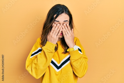 Young hispanic girl wearing casual clothes rubbing eyes for fatigue and headache, sleepy and tired expression. vision problem