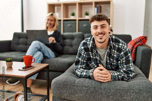 Fototapeta Naklejka Na Ścianę i Meble -  Young caucasian couple smiling happy at home.