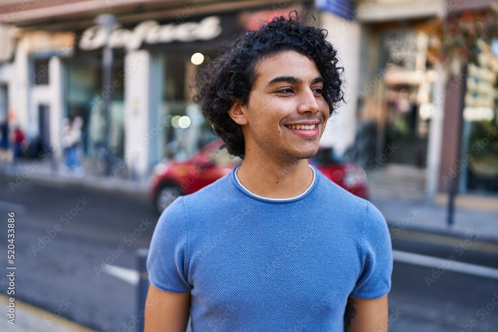 Young hispanic man smiling confident standing at street Young hispanic man smiling confident standing at street