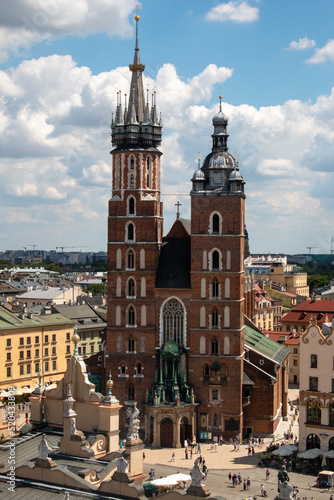 Krakow, Poland, July 15th 2022 - St. Mary's Basilica and the market square in the old city center, the view from the Town Hall Tower.