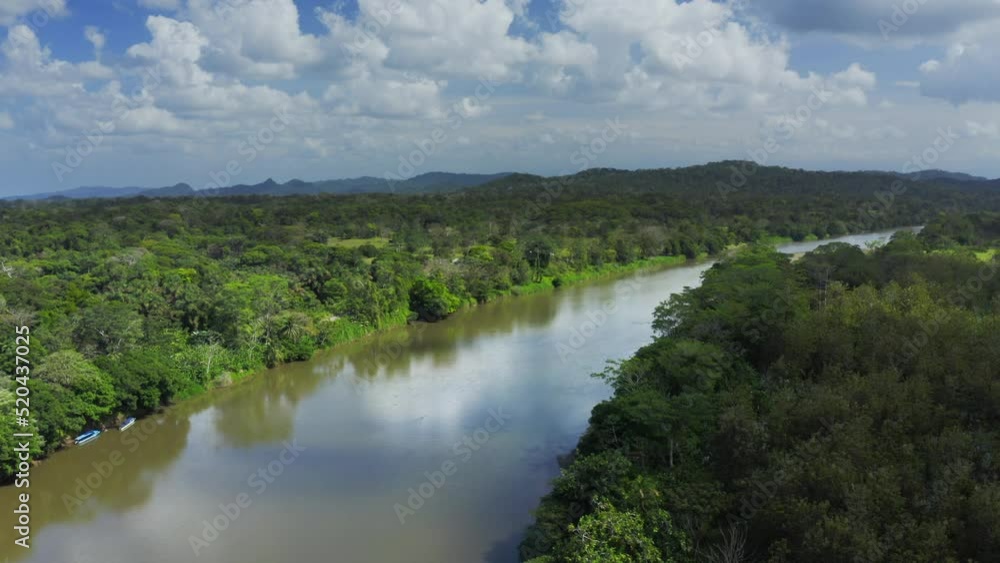 Aerial Drone View of Rainforest River and Mountains Scenery in Costa Rica at Boca Tapada, San Carlos River (Rio San Carlos) that Connects to Nicaragua in Central America, High Shot Above Trees Aerial Drone View of Rainforest River and Mountains Scenery in Costa Rica at Boca Tapada, San Carlos River (Rio San Carlos) that Connects to Nicaragua in Central America, High Shot Above Trees