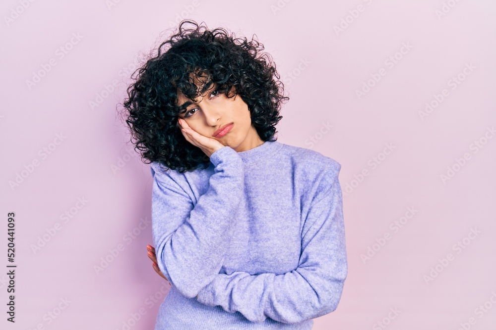 Young middle east woman wearing casual clothes thinking looking tired and bored with depression problems with crossed arms. Young middle east woman wearing casual clothes thinking looking tired and bored with depression problems with crossed arms.
